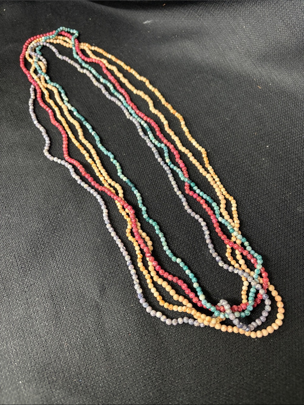 Multiple stone bead necklaces in Red, Teal, blue and tan